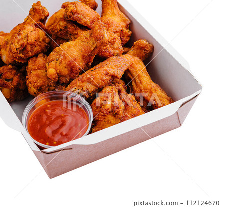 Takeaway box of crispy grilled chicken legs 112124670