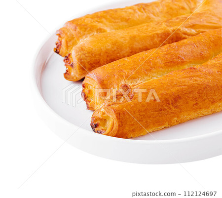 Sweet puff pastry bun with apple jam 112124697