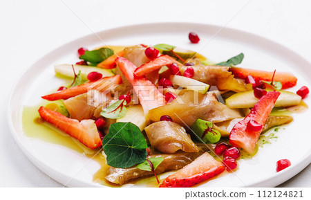 fish with strawberries, pears and pomegranates in sauce fish with strawberries, pears and pomegranates in sauce 112124821