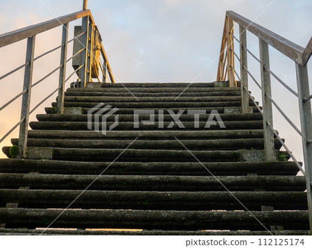 Staircase leading up. Old stairs and sky. R Lift concept. Raise up. Staircase leading up. Old stairs and sky. R Lift concept. Raise up. 112125174