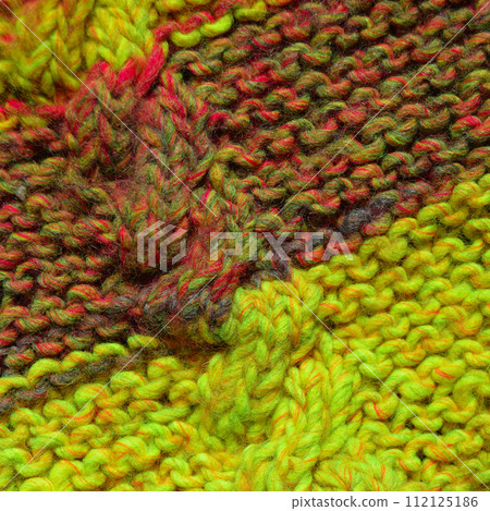 Handmade knitted fabric colored wool background texture Handmade knitted fabric colored wool background texture 112125186