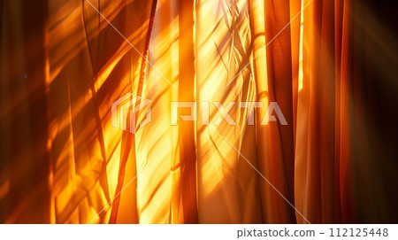 Sunlight and rays are perceived through closed silk curtains. 112125448