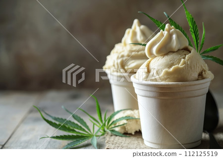 Cannabis food ice cream on a wooden table. Marijuana cannabis edibles 112125519