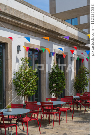 Porto restaurant with San Juan festival flags decorations Porto restaurant with San Juan festival flags decorations 112125588