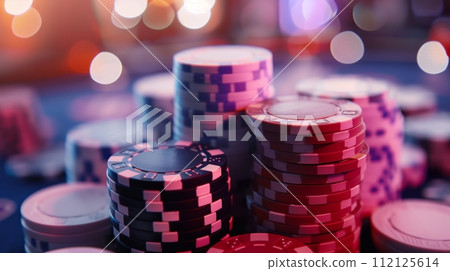 "Extremely close-up of a few casino chips stacked, with shallow depth of field and smooth lighting." 112125614