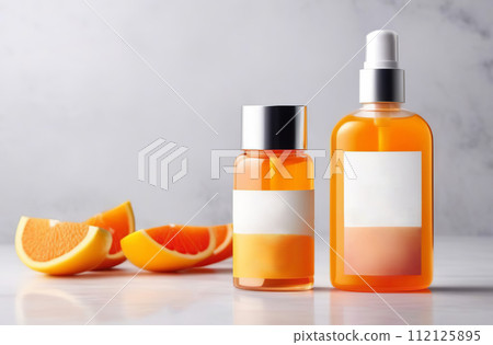 Empty bottle jar template for natural fruit cosmetics and personal skin care bio eco products. Label mock up. Blank packaging tube on a marble white background. Orange, peach slices. Display concept. 112125895