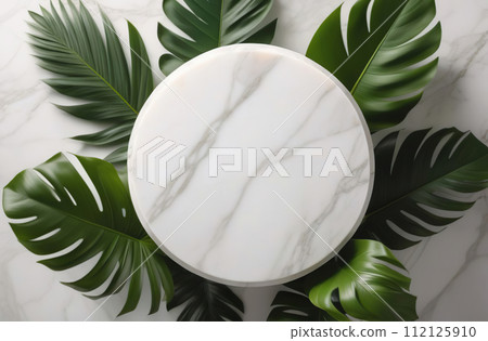 Empty round podium cosmetic product. Fresh tropical leaves around. Abstract geometrical one form. Cylinder marble white sphere, soft shadow. White background. Trendy showcase, display case. 112125910