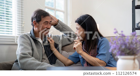 Happy mature husband and wife sit rest on comfortable sofa in living room enjoy talking, smiling elderly couple relax on couch at home chat speak laugh on leisure weekend Happy mature husband and wife sit rest on comfortable sofa in living room enjoy talking, smiling elderly couple relax on couch at home chat speak laugh on leisure weekend 112126574