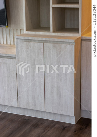 Internal details of the oak wooden cabinet. Detail of modern furniture. 112128044