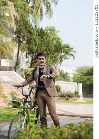 The businessman eco friendly transportation, cycling through the city avenues to go to work. sustainable lifestyle concept 112128703