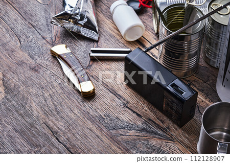 Radio and disaster prevention goods on a wooden table 112128907