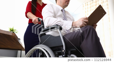 Disabled male preparing report 112128944