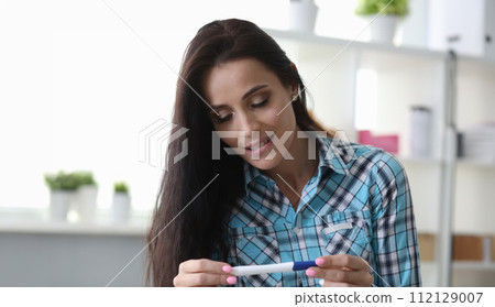 Girl has feeling surprise looking pregnancy test 112129007