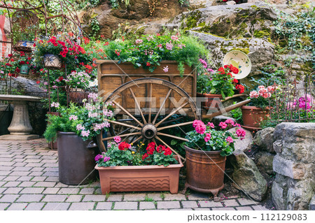 carriage with colorful flowers in Kaysersberg 112129083