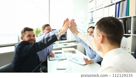 Group of businessman and businesswoman celebrating victory Group of businessman and businesswoman celebrating victory 112129135