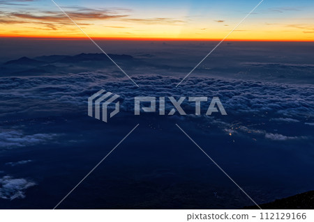 View of the sea of clouds and the Tanzawa/Shonan area at dawn from the summit of Mt. Fuji View of the sea of clouds and the Tanzawa/Shonan area at dawn from the summit of Mt. Fuji 112129166