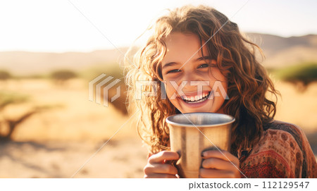 Poor, beggar, hungry Caucasian child girl in Africa, thirsty to drink water. 112129547