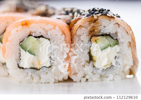 Japanese food restaurant, sushi maki gunkan roll plate or platter set. Sushi set and composition Japanese food restaurant, sushi maki gunkan roll plate or platter set. Sushi set and composition 112129610