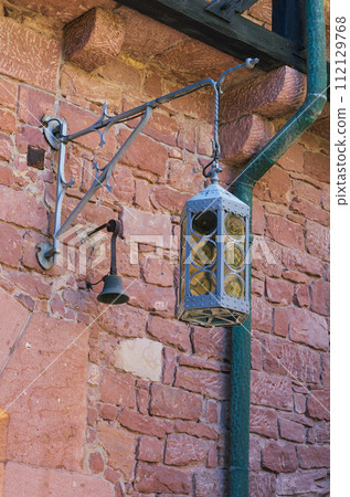 vintage lantern on the background of a brick wall alsace vintage lantern on the background of a brick wall alsace 112129768