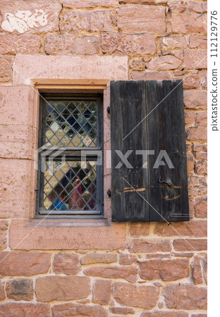 old window with shutters 112129776