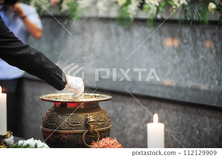 Incense burning in an incense burner Incense burning in an incense burner 112129909
