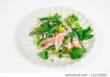 Japanese-style salad with flavored vegetables and chicken tataki Japanese-style salad with flavored vegetables and chicken tataki 112129987