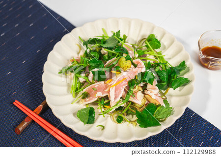 Japanese-style salad with flavored vegetables and chicken tataki Japanese-style salad with flavored vegetables and chicken tataki 112129988