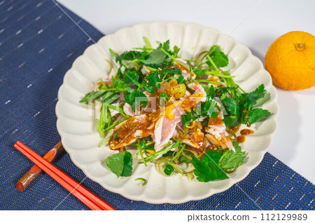 Japanese-style salad with flavored vegetables and chicken tataki Japanese-style salad with flavored vegetables and chicken tataki 112129989