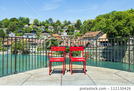 two red chairs in the old town of Bern 112130426