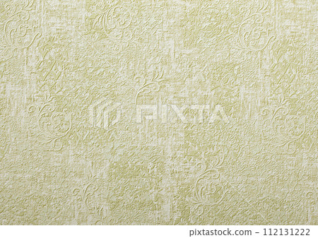Background of green wallpaper or plaster wall with vintage swirl pattern. 112131222