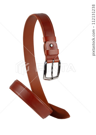 A brown leather belt with a metal buckle is beautifully curved and isolated on a white background. 112131238