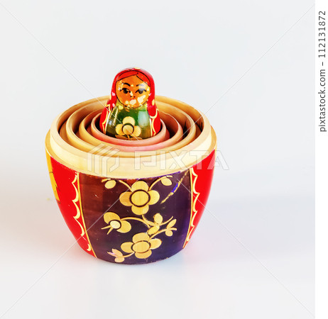 Matryoshka, a Russian wooden doll on a white background Matryoshka, a Russian wooden doll on a white background 112131872