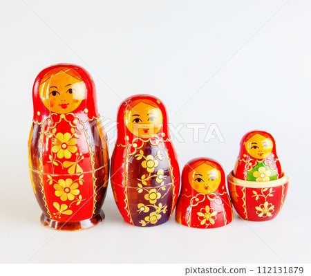 Matryoshka, a Russian wooden doll on a white background Matryoshka, a Russian wooden doll on a white background 112131879