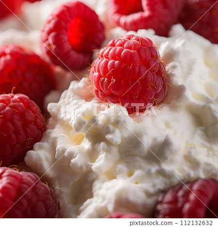 Healthy breakfast of cottage cheese with ripe raspberry closeup Healthy breakfast of cottage cheese with ripe raspberry closeup 112132632