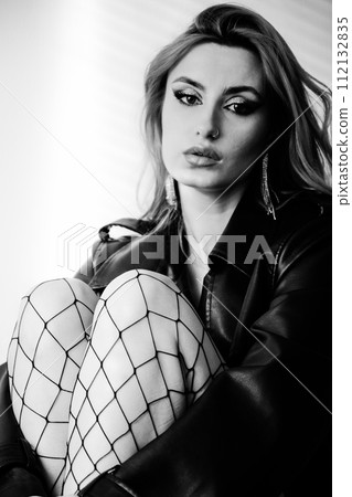 woman in leather coat 112132835