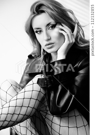 woman in leather coat 112132855