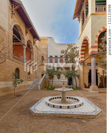 Traditional Mamluk Architecture Courtyard With marble Fountain and Staircase in the Afternoon Traditional Mamluk Architecture Courtyard With marble Fountain and Staircase in the Afternoon 112133696