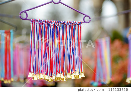 Vrbica orthodox holiday. Small bells, wreaths from willow branches and flowers selling near church. Kids and young girls wearing wreaths. 112133836