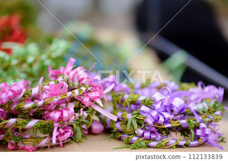 Vrbica orthodox holiday. Small bells, wreaths from willow branches and flowers selling near church. Kids and young girls wearing wreaths. 112133839