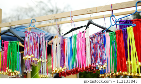 Vrbica orthodox holiday. Small bells, wreaths from willow branches and flowers selling near church. Kids and young girls wearing wreaths. 112133843