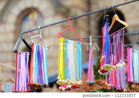 Vrbica orthodox holiday. Small bells, wreaths from willow branches and flowers selling near church. Kids and young girls wearing wreaths. 112133857