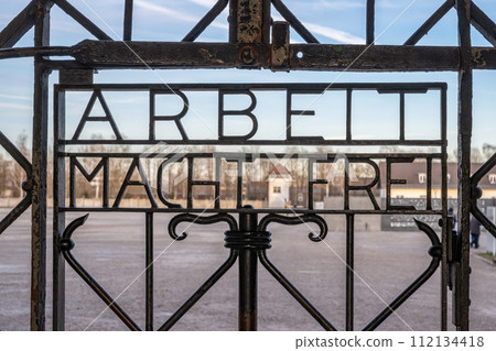DACHAU, GERMANY Work sets you free sign on gates at Dachau Concentration Camp DACHAU, GERMANY Work sets you free sign on gates at Dachau Concentration Camp 112134418