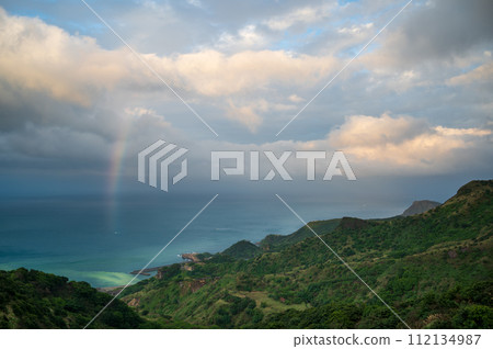View of the sea, rainbows and moving clouds from the top of the mountain. 112134987