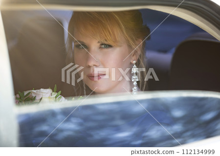 Beautiful bride in a wedding car Beautiful bride in a wedding car 112134999