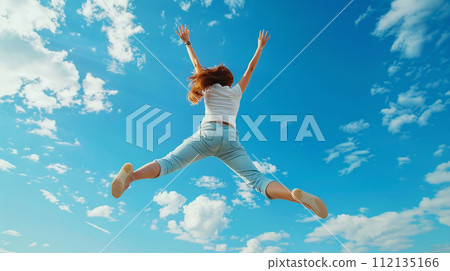 woman jumping in the blue sky woman jumping in the blue sky 112135166