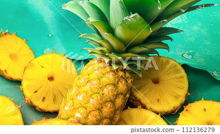 Pineapple whole and slices with water drops on green. Banner with fresh Pineapple fruit, with Copy Space Pineapple whole and slices with water drops on green. Banner with fresh Pineapple fruit, with Copy Space 112136279
