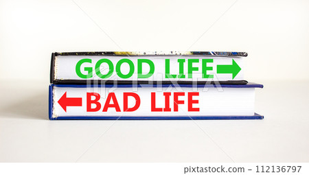 Good or bad life symbol. Concept word Good life Bad life on beautiful books. Beautiful white table white background. Business and Good or bad life concept. Copy space. 112136797