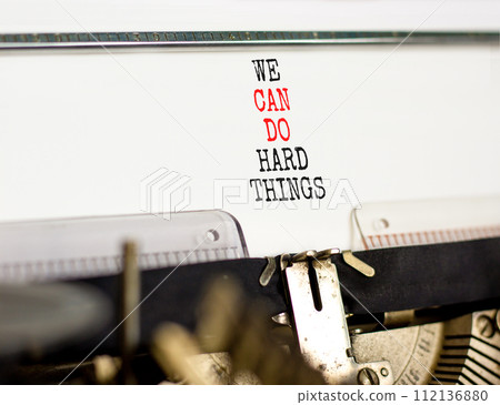 We can do hard things symbol. Concept words We can do hard things typed on beautiful old retro typewriter. Beautiful white background. Business, we can do hard things concept. Copy space. 112136880
