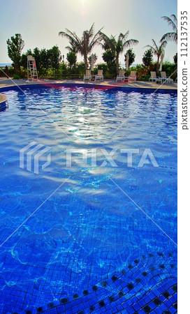 Scenery of the pool at a tropical resort hotel Scenery of the pool at a tropical resort hotel 112137535