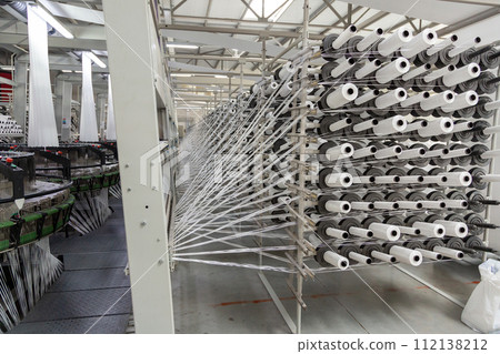 A range of equipment with spools of polypropylene threads. A range of equipment with spools of polypropylene threads. 112138212